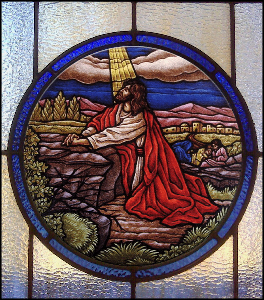 Round hand-painted stained glass window of Christ praying in the Garden of Gethsemane, by Monica Huber